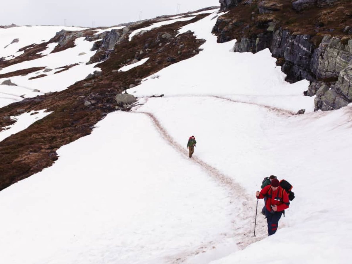 Best time for Everest Base Camp during peak ; A hiker dressed in layers of clothing